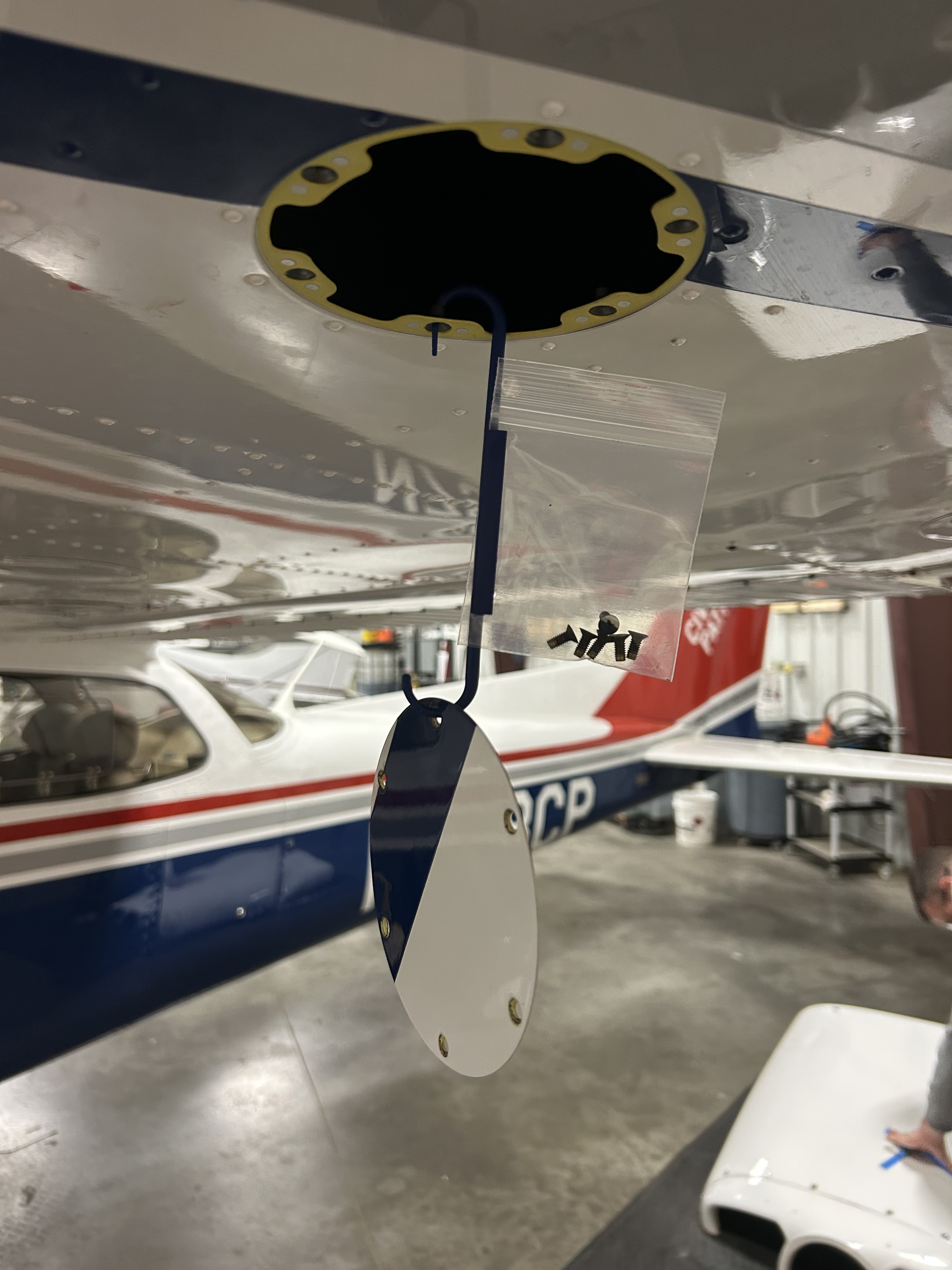 Hangar Bag with panel and fasteners attached to aircraft